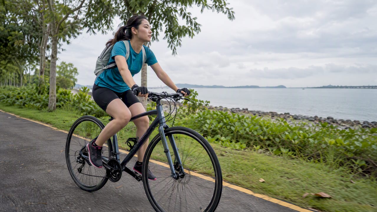Cyclist riding the coastal park connector