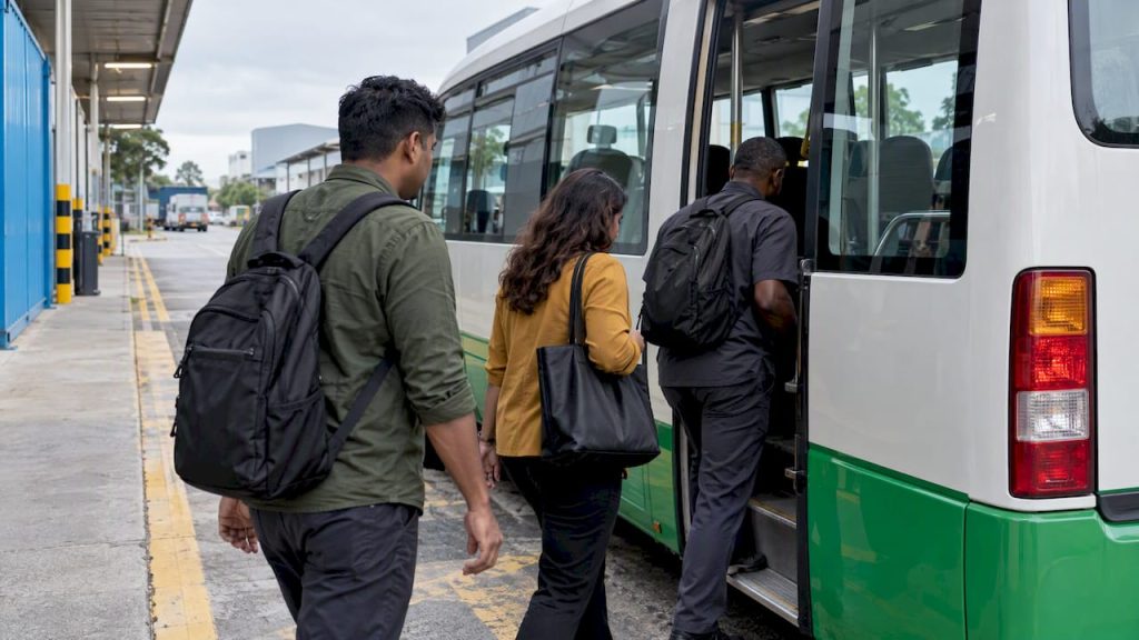 Employees boarding a contracted morning shuttle